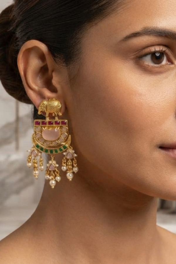 Women's Gold-Tone Traditional Kundan-Style Chandbali Dangle Earrings with Pink and Green Stone Detailing## Product Name  Women's Gold-Tone Traditional Kundan-Style Chandbali Dangle Earrings with Pink and Green Stone Detailing  ## Product Specifications  | Attribute       | Specification                                                | | --------------- | ------------------------------------------------------------ | | Product Type    | Women's Traditional Drop Earrings                            | | Color           | Gold-Tone with Pink, Green, and White Accents                | | Pattern         | Traditional Ornamental Design                                | | Style           | Ethnic / Festive / Traditional                               | | Design          | Elephant Motif with Crescent-Shaped Chandbali Design         | | Stone Detailing | Pink, Green, and White Stone-Like Details Visible            | | Earring Type    | Long Dangle Earrings                                         | | Shape           | Crescent / Chandbali                                         | | Embellishment   | Decorative Stones and Intricate Gold-Tone Detailing          | | Quantity        | 1 Pair                                                       | | Occasion        | Festive, Wedding, Partywear, and Traditional Occasions       | | Size & Fit      | Long, Statement-Style Design; Exact Dimensions Not Available | | Closure Type    | Not Clearly Visible                                          | | Brand           | Not Specified                                                | | Material        | Cannot Be Confirmed from Image                               |